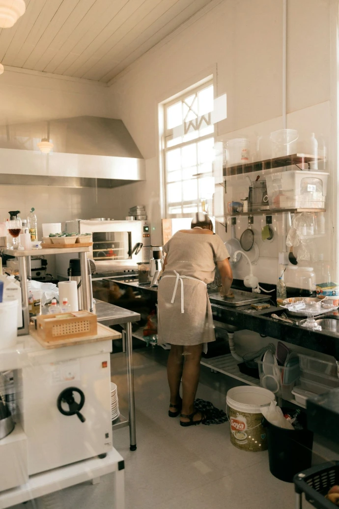 A person working in a commercial kitchen.